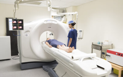 Woman in having CAT scan with radiologist by machine. PET scan equipment. Medical scan of patient. Radiography.